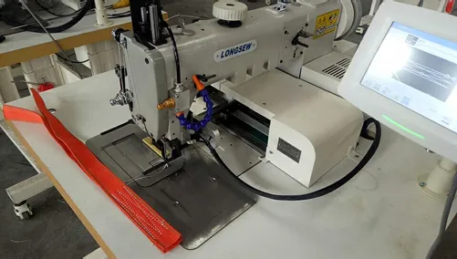 sewing machine with automatic backstitch