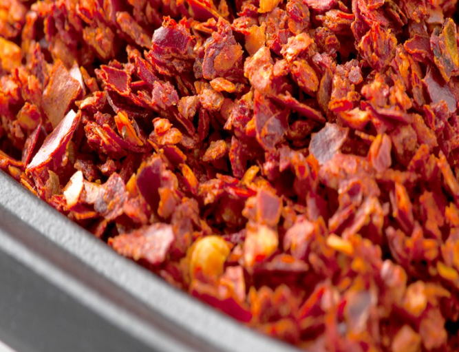 Hot pepper flakes gochugaru in bibimbap sauce