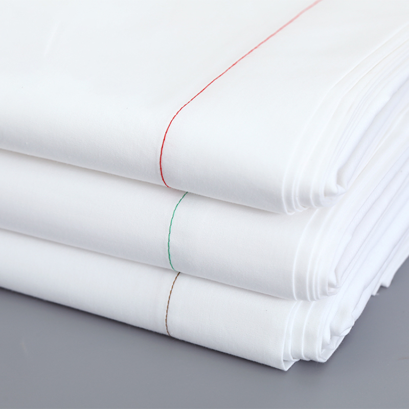 White satin sheets creating a luxurious and elegant atmosphere in the room.