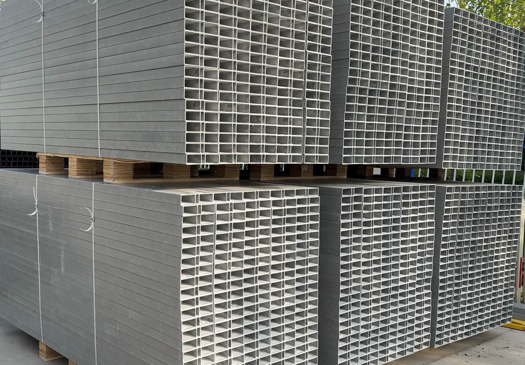 Neatly Packaged and Stacked: FRP Rectangular Tubes Ready for Dispatch