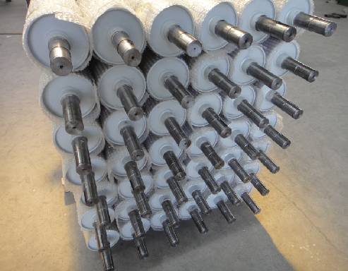 Spring-loaded rollers for guiding, controlling and supporting in industrial machinery and equipment applications.
