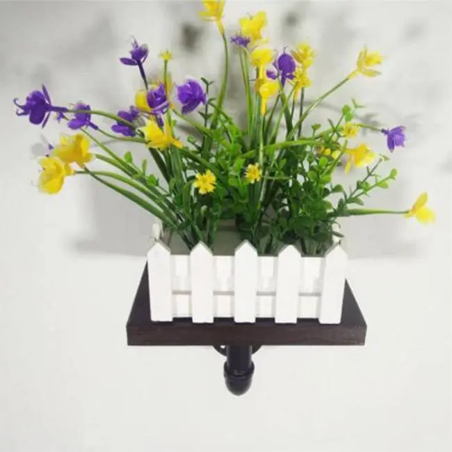 wall mounted plant, paper holder by black cast iron pipe fittings and floor flange