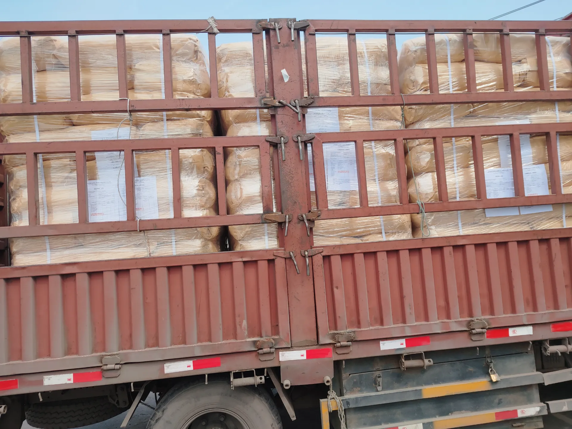 Synthetic Fiber Treatment with 6-Amino-1,3-dimethyl-5-nitrosouracil Compounds