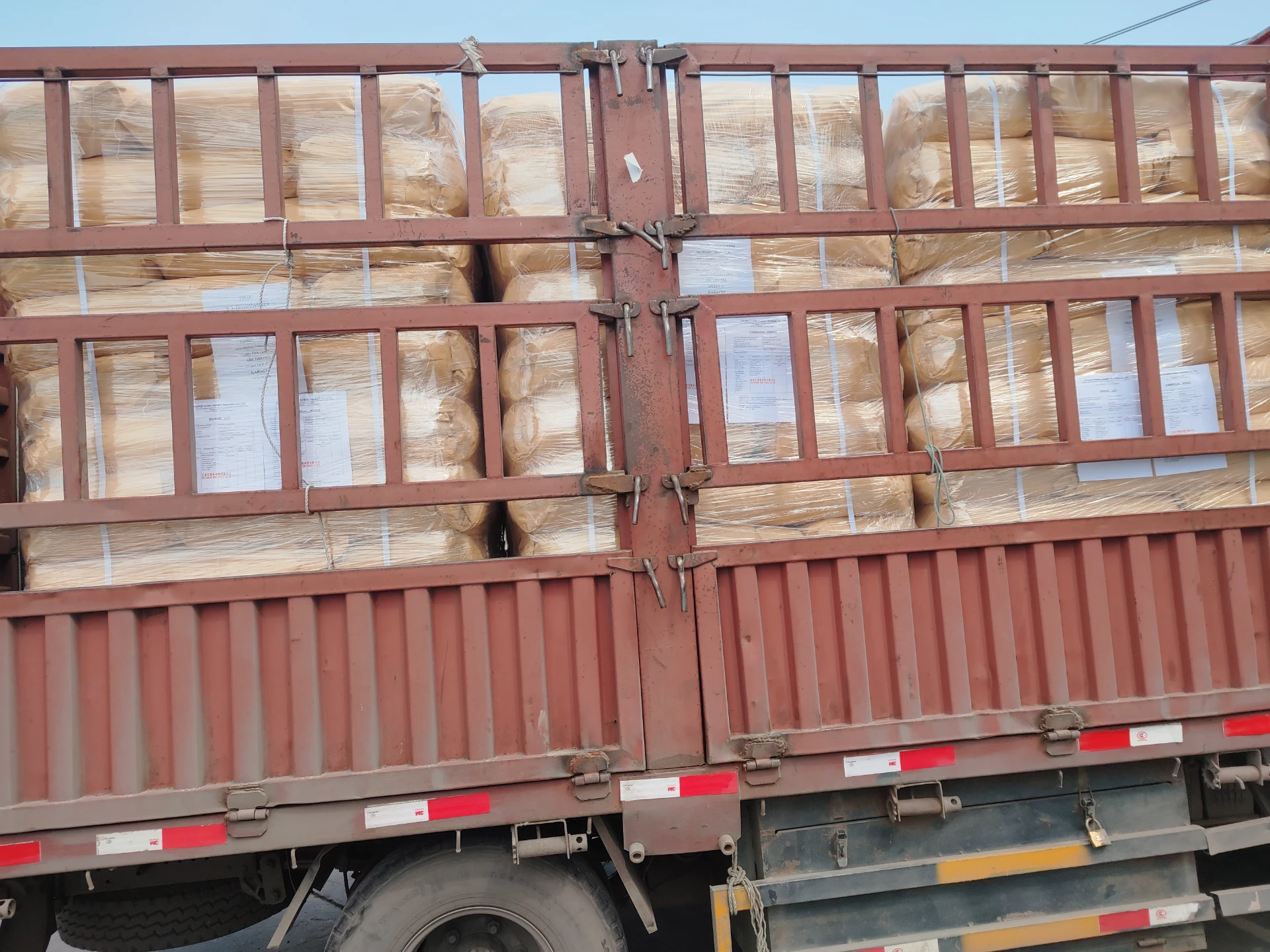 Synthetic Fiber Treatment with 6-Amino-1,3-dimethyl-5-nitrosouracil Compounds