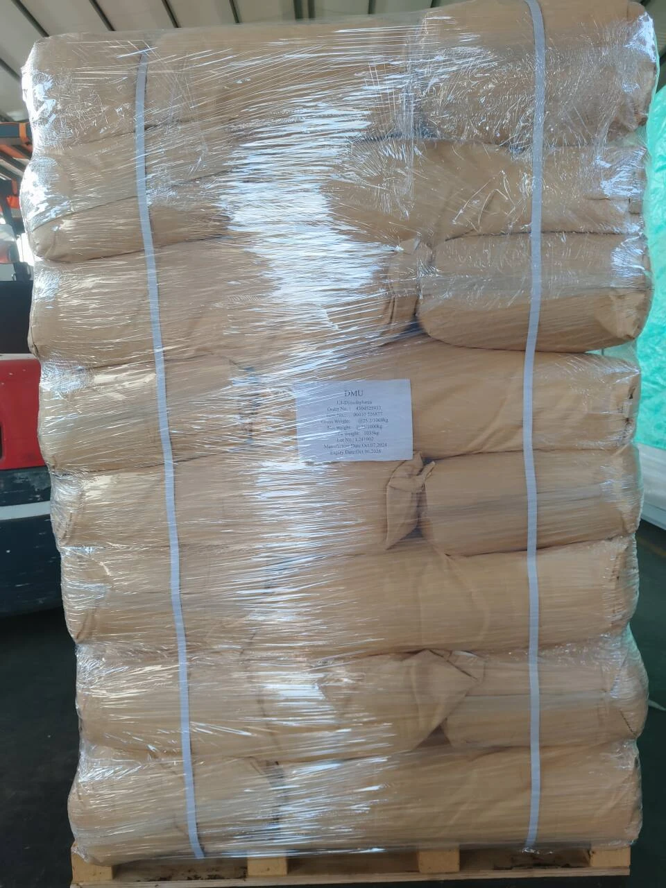 Study on Application of 6-Amino-1,3-Dimethyluracil as Fiber Treatment Agent