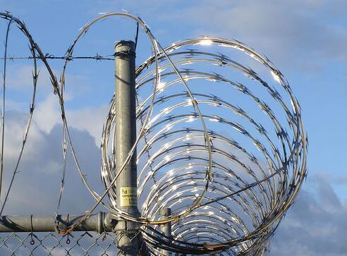 The blade pierces the rope in a straight line