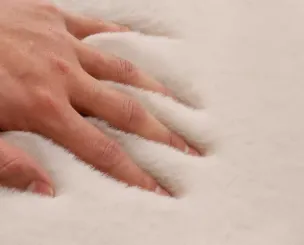 Layering a Faux Sheepskin Rug Over Hardwood Floors