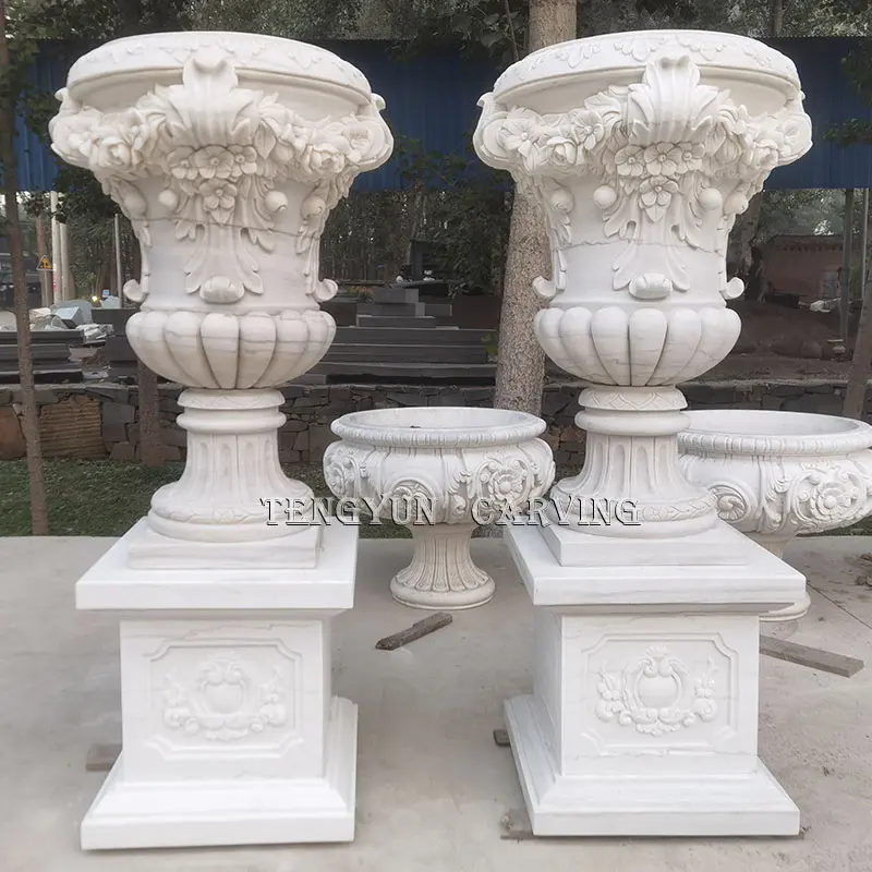 Pair of Natural Marble Carved Planters with Floral Motifs and Stone Bases