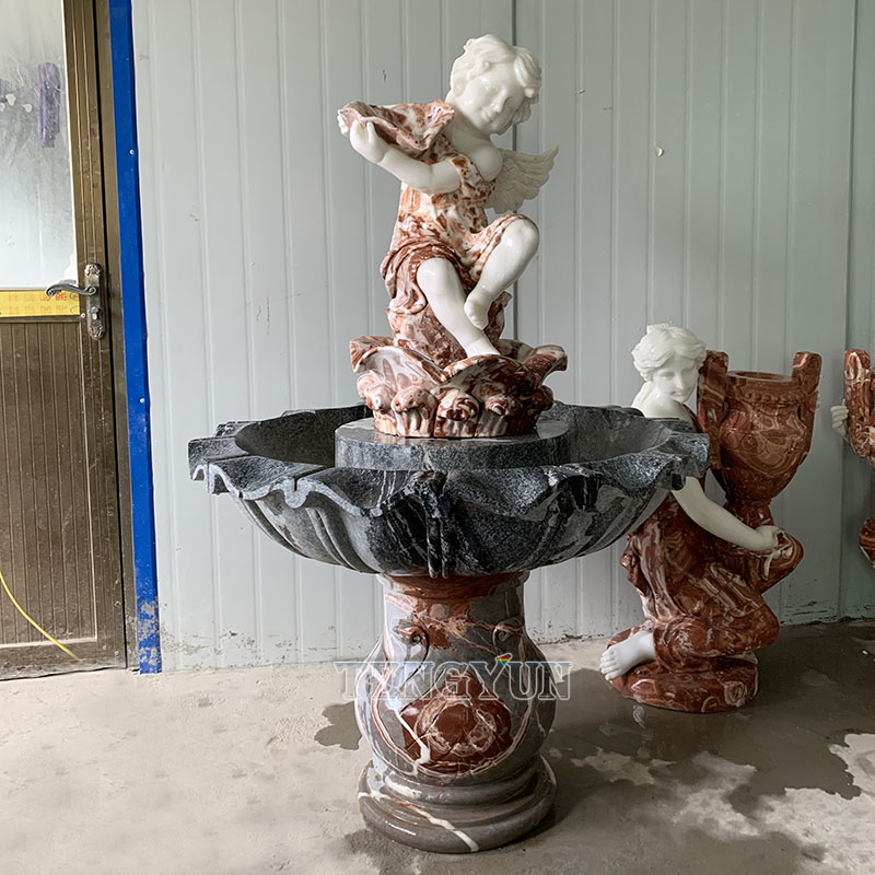 https://www.firststatue.com/outdoor-garden-decorative-natural-marble-hand-carved-small-angel-statue-cherub-water-fountain-product/
