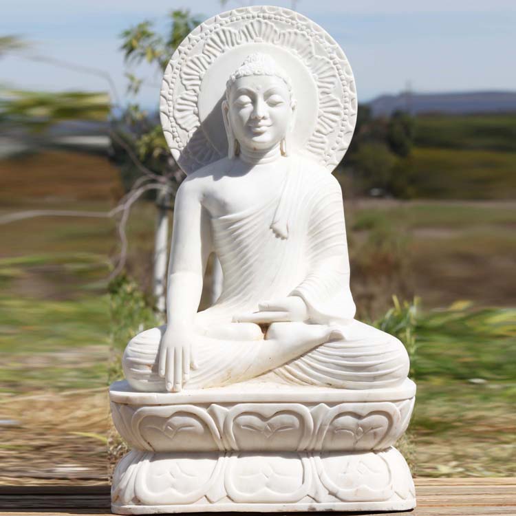 stone meditating buddha