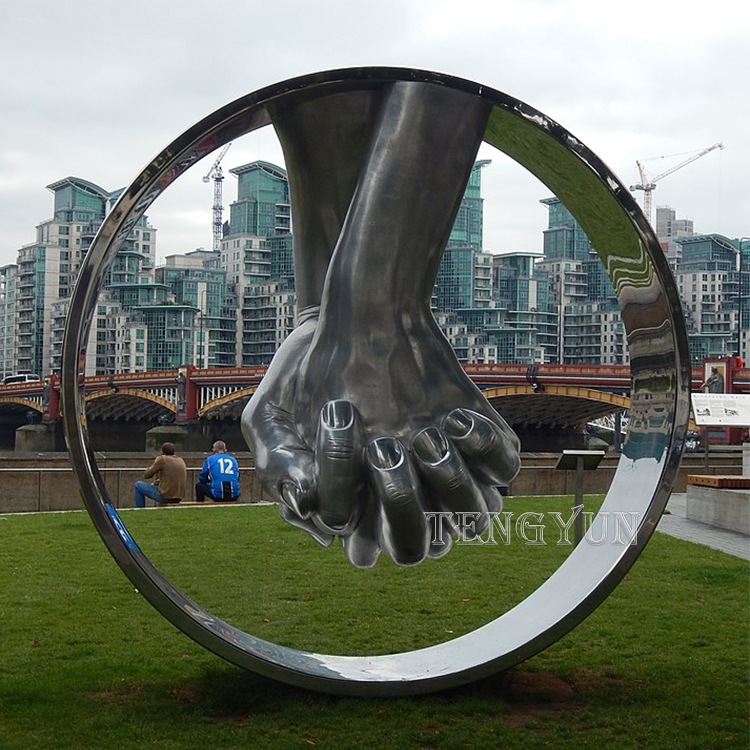 https://www.firststatue.com/outdoor-stainless-steel-two-hands-clasped-big-size-ring-modern-sculpture-product/