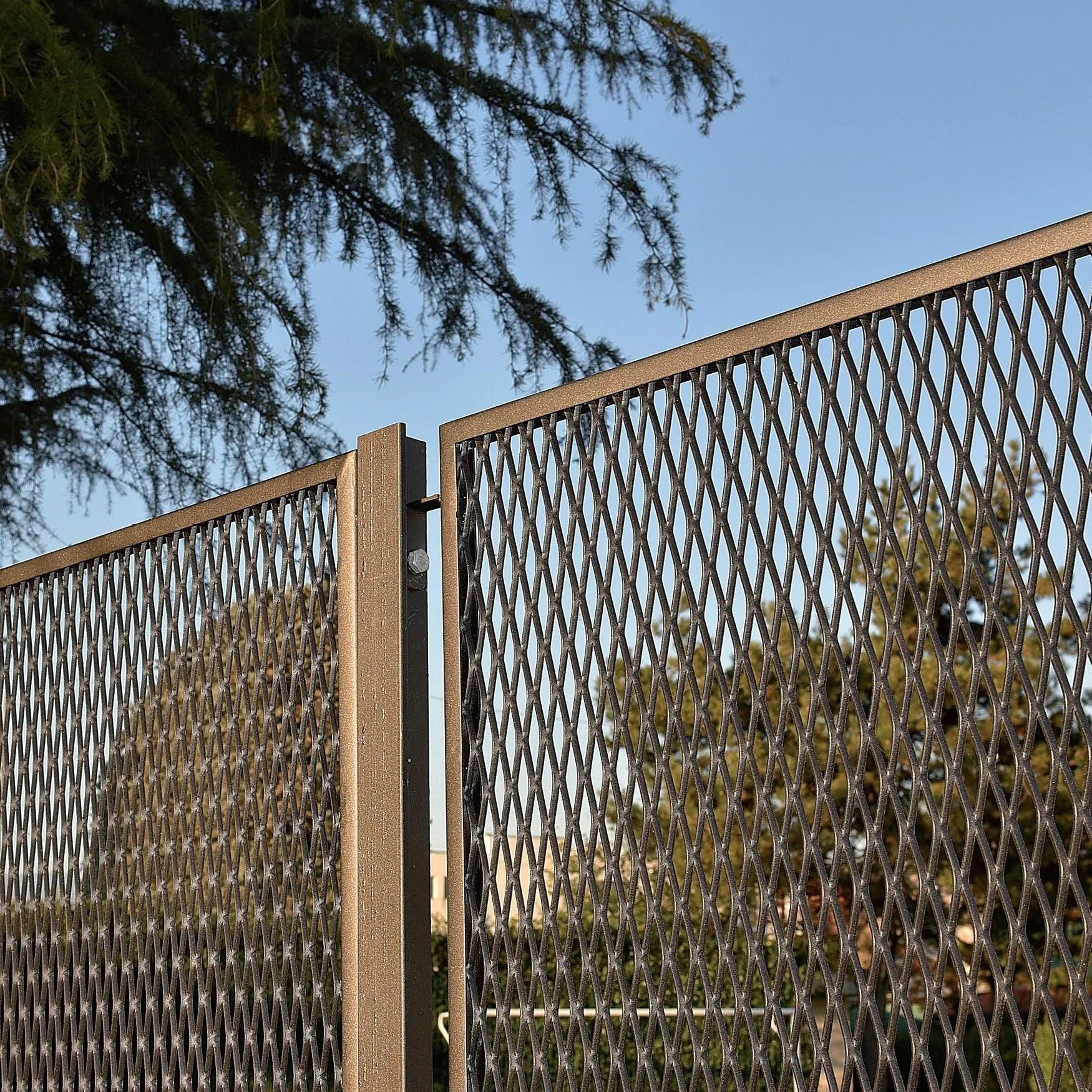 Breathability and protection of expanded metal mesh fences