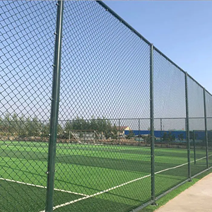 What should you pay attention to when spraying plastic on the football field fence?