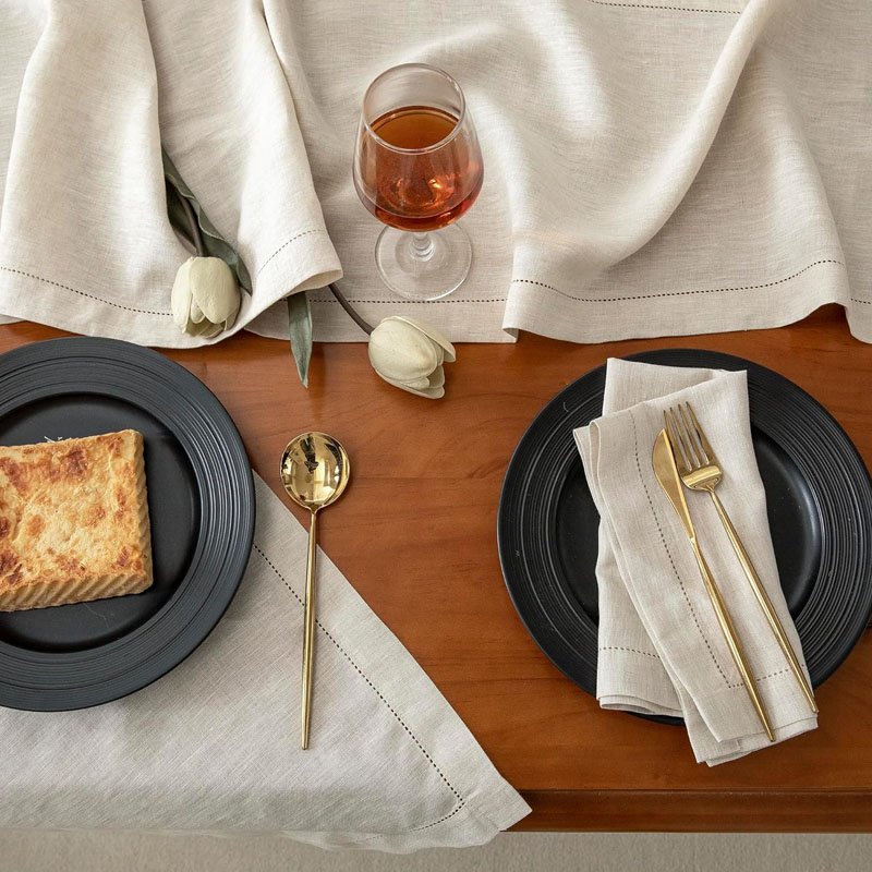 Wholesale embroidered placemat and napkin set for bulk purchase and resale.