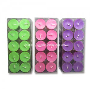 Colored and scented tea light candle in metal cups making